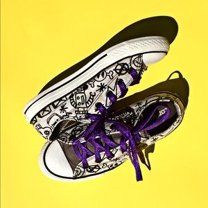 Converse sneakers with purple glitter laces